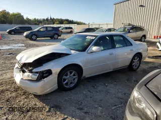2000 Cadillac Seville Touring STS z VIN 1G6KY5497YU345038, wystawiony jako Copart lot #74315354 z przebiegiem 96 704 mil mil oraz Nie do naprawy. Historia ofert i sprzedaży dostępna na DreamBid. Obrazek 1.