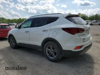 2017 Hyundai Santa Fe 2.4L z VIN 5XYZUDLB7HG388382, wystawiony jako Copart lot #57167315 z przebiegiem 128 724 mil mil oraz Szkoda całkowita • Salvage title. Historia ofert i sprzedaży dostępna na DreamBid. Obrazek 2.