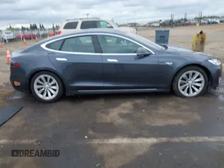 2016 Tesla Model S 90D with VIN 5YJSA1E27GF129824, listed as a IAAI auction lot 42058080 with 113,171 mi miles and . Bid and sale history available at DreamBid. Image 14.
