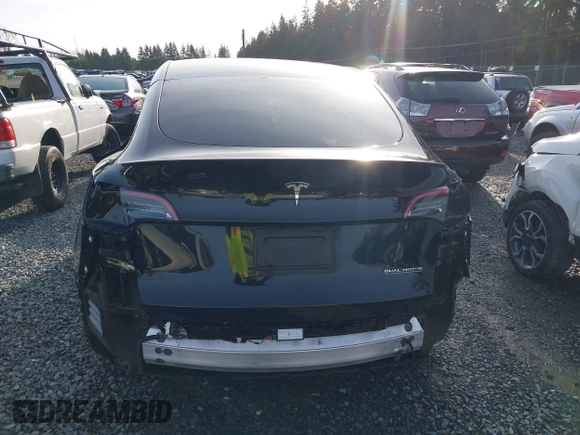 2022 Tesla Model Y Performance with VIN 7SAYGDEF0NF406262, listed as a IAAI auction lot 41132514 with 27,171 mi miles. Bid and sale history available at carsss.com. Image 17.