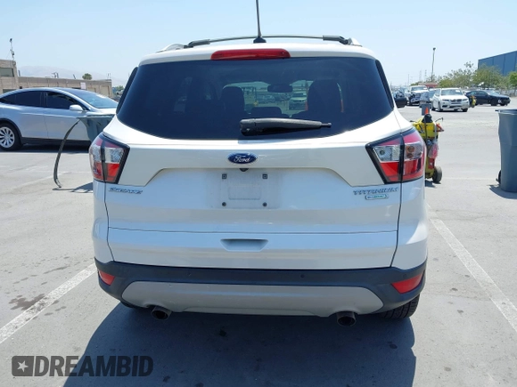 2018 Ford Escape Titanium with VIN 1FMCU0J94JUB26110, listed as a IAAI auction lot 42436285 with 59,586 mi miles and . Bid and sale history available at DreamBid. Image 16.