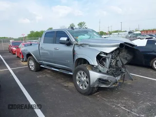 2021 Ram 2500 Laramie z VIN 3C6UR5FL5MG516837, wystawiony jako IAAI lot #41989648 z przebiegiem Nie podano mil oraz . Historia ofert i sprzedaży dostępna na DreamBid. Obrazek 1.