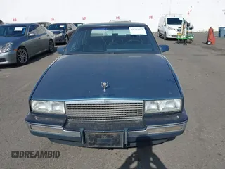 1986 Cadillac Seville z VIN 1G6KS6989GU813079, wystawiony jako IAAI lot #41732353 z przebiegiem Nie podano mil oraz . Historia ofert i sprzedaży dostępna na DreamBid. Obrazek 12.