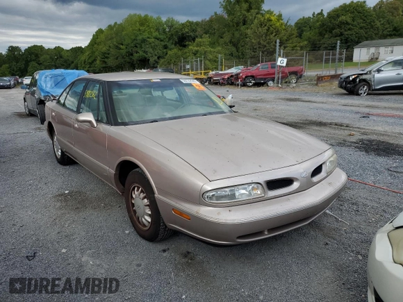 1998 Oldsmobile 88 LS z VIN 1G3HN52K0W4857890, wystawiony jako Copart lot #56019374 z przebiegiem 170 105 mil mil oraz Szkody całkowita. Historia ofert i sprzedaży dostępna na DreamBid. Obrazek 1.