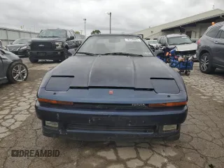 1988 Toyota Supra z VIN JT2MA71J0J0087102, wystawiony jako Copart lot #78730904 z przebiegiem 83 787 mil mil oraz Czysty tytuł • Clean title. Historia ofert i sprzedaży dostępna na DreamBid. Obrazek 5.