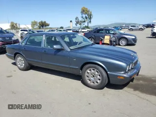 1998 Jaguar XJ with VIN SAJHX1247WC841374, listed as a Copart auction lot 51693595 with 109,509 mi miles and Clean Title. Bid and sale history available at DreamBid. Image 4.
