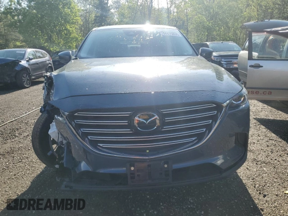 2023 Mazda CX-9 Touring z VIN JM3TCBCYXP0650893, wystawiony jako Copart lot #56875635 z przebiegiem 30 055 mil mil oraz Czysty tytuł • Clean title. Historia ofert i sprzedaży dostępna na DreamBid. Obrazek 5.