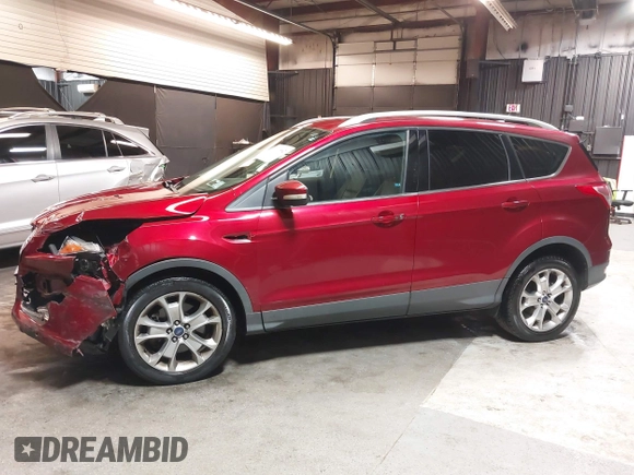 2014 Ford Escape Titanium with VIN 1FMCU9J9XEUD69589, listed as a IAAI auction lot 42031882 with 123,632 mi miles and . Bid and sale history available at DreamBid. Image 14.