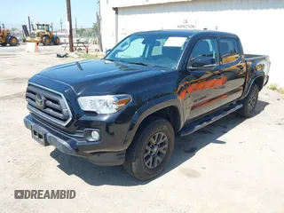 2023 Toyota Tacoma SR with VIN 3TMCZ5AN1PM654572, listed as a IAAI auction lot 42312575 with 14,111 mi miles and . Bid and sale history available at DreamBid. Image 18.