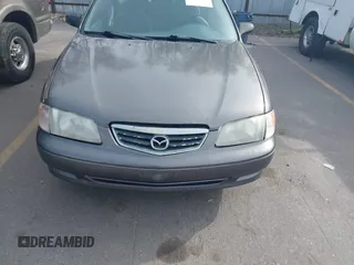2001 Mazda 626 LX with VIN 1YVGF22C815218444, listed as a IAAI auction lot 41940404 with 143,080 mi miles. Bid and sale history available at carsss.com. Image 6.