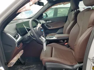 2023 BMW X1 xDrive28i with VIN WBX73EF06P5V77660, listed as a Copart auction lot 57342015 with 32,028 mi miles and Salvage title. Bid and sale history available at DreamBid. Image 7.