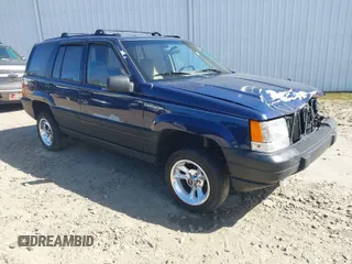 1993 Jeep Grand Cherokee Laredo with VIN 1J4GZ58S9PC524077, listed as a IAAI auction lot 41831867 with 215,405 mi miles. Bid and sale history available at carsss.com. Image 1.