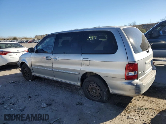 2003 Kia Sedona LX with VIN KNDUP131236371153, listed as a Copart auction lot 80989974 with 205,181 mi miles and Salvage Title. Bid and sale history available at carsss.com. Image 2.