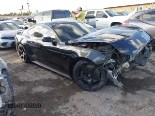 2019 Ford Mustang GT with VIN 1FA6P8CF0K5122857, listed as a IAAI auction lot 40722647 with 54,561 mi miles. Bid and sale history available at carsss.com. Image 1.