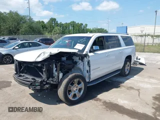 2020 Chevrolet Suburban Premier with VIN 1GNSCJKC9LR125292, listed as a IAAI auction lot 42073858 with 92,363 mi miles and . Bid and sale history available at DreamBid. Image 2.