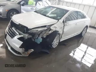 2018 Cadillac XTS Luxury z VIN 2G61M5S38J9156679, wystawiony jako IAAI lot #41574733 z przebiegiem 65 637 mil mil oraz . Historia ofert i sprzedaży dostępna na DreamBid. Obrazek 2.