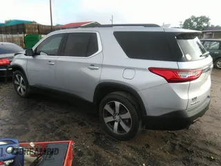 2021 Chevrolet Traverse LT with VIN 1GNERHKW6MJ157311, listed as a IAAI auction lot 42256458 with 97,635 mi miles and . Bid and sale history available at DreamBid. Image 3.