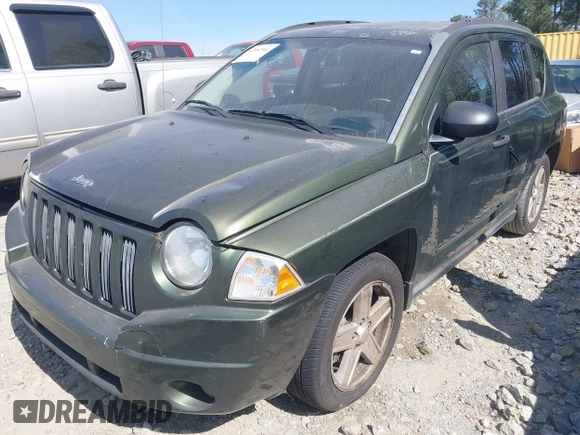 2008 Jeep Compass Sport with VIN 1J8FF47WX8D758998, listed as a IAAI auction lot 42061944 with 271,977 mi miles and . Bid and sale history available at carsss.com. Image 2.