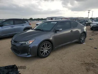 2015 Scion tC z VIN JTKJF5C72FJ012591, wystawiony jako Copart lot #54290365 z przebiegiem 115 554 mil mil oraz Czysty tytuł • Clean title. Historia ofert i sprzedaży dostępna na DreamBid. Obrazek 1.