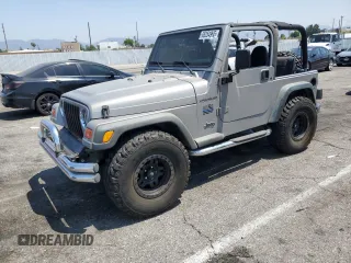 2000 Jeep Wrangler SE with VIN 1J4FA29P3YP739914, listed as a Copart auction lot 65254995 with 79,895 mi miles and Salvage title. Bid and sale history available at DreamBid. Image 1.