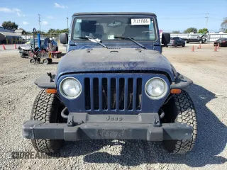 2005 Jeep Wrangler Rubicon with VIN 1J4FA69S05P351725, listed as a Copart auction lot 71411904 with 144,557 mi miles and Salvage Title. Bid and sale history available at carsss.com. Image 5.