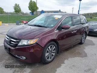 2014 Honda Odyssey Touring with VIN 5FNRL5H9XEB073156, listed as a IAAI auction lot 41990714 with 166,129 mi miles and . Bid and sale history available at DreamBid. Image 2.