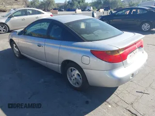 2002 Saturn SC with VIN 1G8ZY14732Z144888, listed as a IAAI auction lot 41617831 with 138,564 mi miles. Bid and sale history available at carsss.com. Image 3.