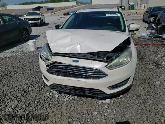 2016 Ford Focus Titanium z VIN 1FADP3J25GL201003, wystawiony jako Copart lot #53799745 z przebiegiem 194 055 mil mil oraz Szkoda całkowita • Salvage title. Historia ofert i sprzedaży dostępna na DreamBid. Obrazek 13.