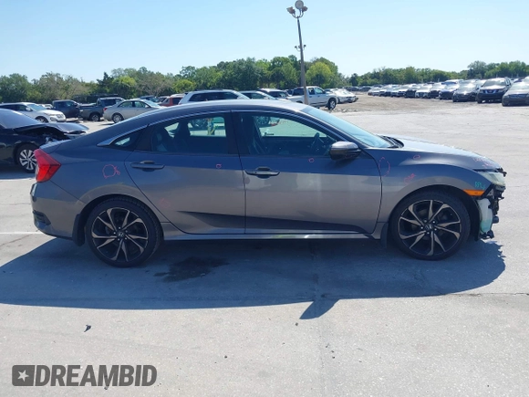 2019 Honda Civic Sport with VIN 19XFC2F89KE019683, listed as a IAAI auction lot 42055871 with 107,941 mi miles and . Bid and sale history available at DreamBid. Image 14.