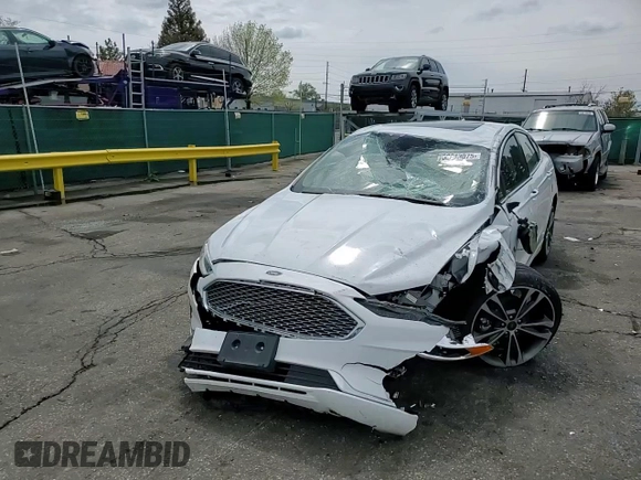 2020 Ford Fusion Titanium z VIN 3FA6P0D96LR205475, wystawiony jako Copart lot #56313075 z przebiegiem 30 888 mil mil oraz Szkoda całkowita • Salvage title. Historia ofert i sprzedaży dostępna na DreamBid. Obrazek 13.
