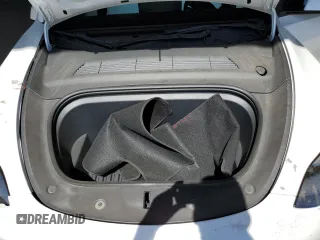 2022 Tesla Model Y Performance z VIN 7SAYGDEF0NF337959, wystawiony jako Copart lot #56871985 z przebiegiem 54 527 mil mil oraz Szkoda całkowita • Salvage title. Historia ofert i sprzedaży dostępna na DreamBid. Obrazek 11.