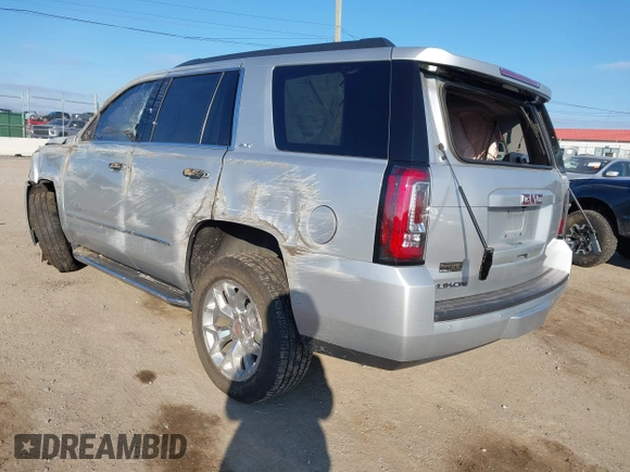 2020 GMC Yukon SLT Standard Edition with VIN 1GKS2DKCXLR294027, listed as a IAAI auction lot 41004965 with 69,161 mi miles. Bid and sale history available at carsss.com. Image 3.