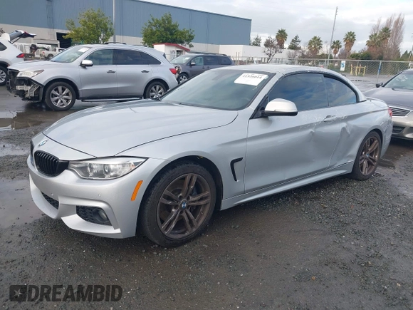 2015 BMW 4 Series 428i with VIN WBA3V7C50FP772915, listed as a IAAI auction lot 41526014 with 116,800 mi miles. Bid and sale history available at carsss.com. Image 2.