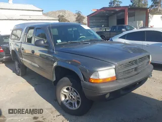 2003 Dodge Dakota SLT with VIN 1D7HG48N33S248568, listed as a IAAI auction lot 41834084 with 153,001 mi miles and . Bid and sale history available at carsss.com. Image 1.