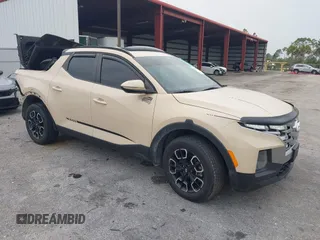 2022 Hyundai Santa Cruz SEL Premium z VIN 5NTJDDAF4NH010416, wystawiony jako IAAI lot #42423272 z przebiegiem 74 599 mil mil oraz . Historia ofert i sprzedaży dostępna na DreamBid. Obrazek 1.