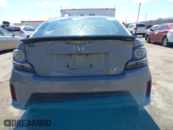 2014 Scion tC with VIN JTKJF5C70E3083839, listed as a IAAI auction lot 41886711 with 118,029 mi miles. Bid and sale history available at carsss.com. Image 16.