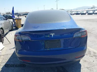 2020 Tesla Model 3 Standard Range Plus with VIN 5YJ3E1EA1LF590396, listed as a IAAI auction lot 41868089 with 51,278 mi miles. Bid and sale history available at carsss.com. Image 16.