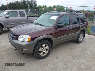 2001 Mazda Tribute LX with VIN 4F2CU08141KM10269, listed as a IAAI auction lot 42138704 with 166,825 mi miles and . Bid and sale history available at carsss.com. Image 2.