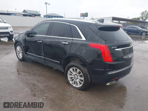 2017 Cadillac XT5 FWD with VIN 1GYKNARS0HZ317508, listed as a IAAI auction lot 40818768 with 132,598 mi miles. Bid and sale history available at carsss.com. Image 3.
