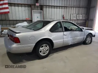 1997 Ford Thunderbird LX z VIN 1FALP62W1VH123205, wystawiony jako Copart lot #76107654 z przebiegiem 120 225 mil mil oraz Szkoda całkowita • Salvage title. Historia ofert i sprzedaży dostępna na DreamBid. Obrazek 3.