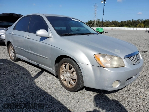2006 Kia Spectra EX with VIN KNAFE121365229594, listed as a Copart auction lot 77311084 with 129,789 mi miles and Salvage Title. Bid and sale history available at carsss.com. Image 4.