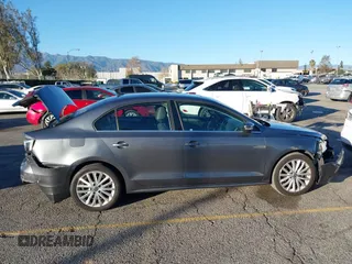 2015 Volkswagen Jetta Sport with VIN 3VWD17AJ2FM318669, listed as a IAAI auction lot 41266868 with 124,539 mi miles and . Bid and sale history available at DreamBid. Image 13.