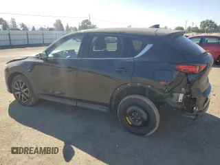2018 Mazda CX-5 Grand Touring с VIN JM3KFADM2J1310339, выставлен на аукционе Copart как лот 64705245 с пробегом 63 927 миль миль и Списание • Salvage title. История ставок и продаж доступна на DreamBid. Изображение 2.
