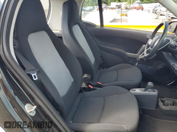 2015 Smart fortwo Passion z VIN WMEEJ3BA8FK797266, wystawiony jako Copart lot #64777655 z przebiegiem 20 995 mil mil oraz Szkoda całkowita • Salvage title. Historia ofert i sprzedaży dostępna na DreamBid. Obrazek 10.
