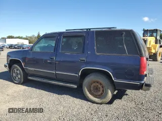 1999 GMC Yukon with VIN 1GKEK13R3XJ757466, listed as a Copart auction lot 75750884 with 270,768 mi miles and Salvage Title. Bid and sale history available at carsss.com. Image 2.