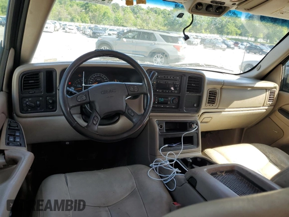 2005 GMC Yukon SLT z VIN 1GKEC13TX5R106956, wystawiony jako Copart lot #52486205 z przebiegiem 317 375 mil mil oraz Szkoda całkowita • Salvage title. Historia ofert i sprzedaży dostępna na DreamBid. Obrazek 8.