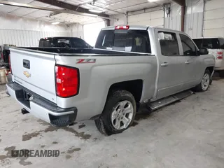 2017 Chevrolet Silverado 1500 LT with VIN 3GCUKREC2HG473554, listed as a IAAI auction lot 42220143 with 80,000 mi miles and . Bid and sale history available at DreamBid. Image 4.
