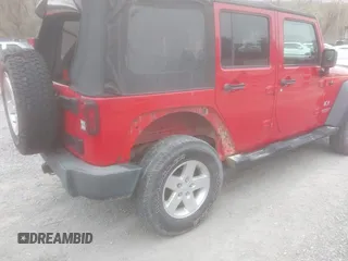 2008 Jeep Wrangler Unlimited X with VIN 1J8GA39128L562347, listed as a IAAI auction lot 41912669 with 106,040 mi miles and . Bid and sale history available at carsss.com. Image 4.