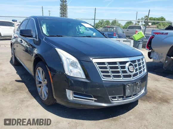 2013 Cadillac XTS Luxury z VIN 2G61R5S32D9226506, wystawiony jako IAAI lot #42208105 z przebiegiem 140 255 mil mil oraz . Historia ofert i sprzedaży dostępna na DreamBid. Obrazek 1.