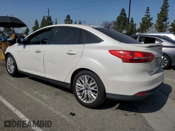 2017 Ford Focus Titanium with VIN 1FADP3J2XHL291606, listed as a Copart auction lot 58268285 with 153,272 mi miles and Salvage title. Bid and sale history available at DreamBid. Image 2.